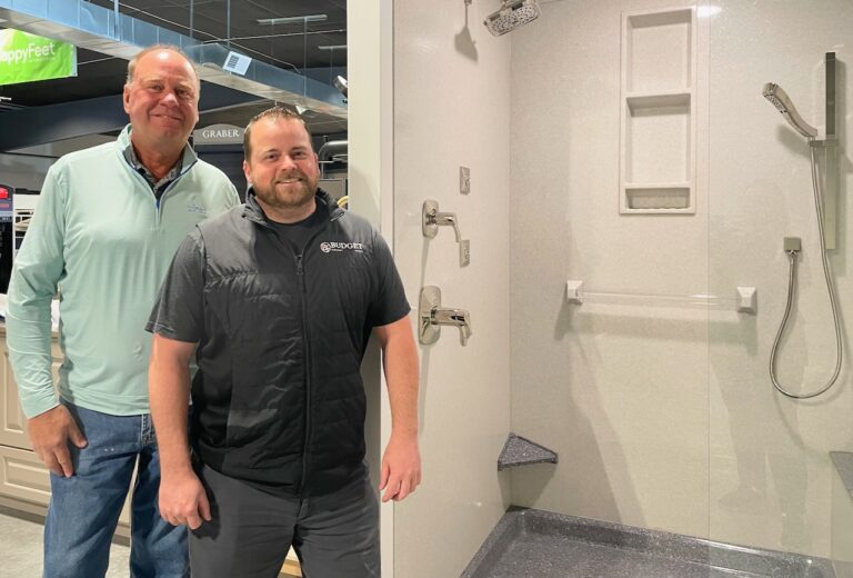 Pat Preston, owner of Splash Creative Bath Solutions, left, has sold his business to Mike Nold at Budget Furniture. Aberdeen Insider photo by Elisa Sand.