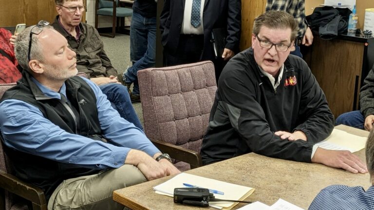 Dave McNeil, chief of the Aberdeen Police Department, left, and Brown County Sheriff Dave Lunzman visit with the Brown County Commission during the Tuesday, April 30 meeting at the courthouse annex. Aberdeen Insider photo by Scott Waltman.