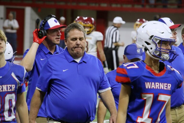 Kerwin Hoellein, head Warner football coach, walks to the sidelines after a timeout during the Class 9A state championship against Deubrook Area. Aberdeen Insider photo by Robb Garofalo.