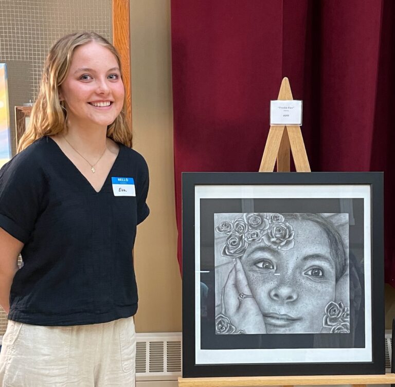 Roncalli High School graduate Eva Madsen and her artwork "Freckle Face" placed first for South Dakota in the Congressional Art Competition. It's on display in the Cannon Tunnel at the U.S. Capitol. There's a piece from one young artist from each state on display in the exhibition. Photo courtesy of Roncalli High School.