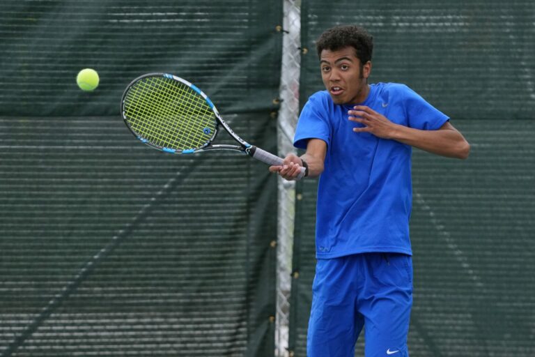 Aberdeen Central's Mason Ligon hits a forehand during his opening round match at the Class AA state tennis tournament in Sioux Falls. Photo courtesy of South Dakota Broadcasting.