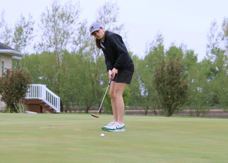 Aberdeen Roncalli's Claire Crawford tracks her putt on the ninth hole Monday, May 20 during the Groton Invitational. Aberdeen Insider photo by Robb Garofalo