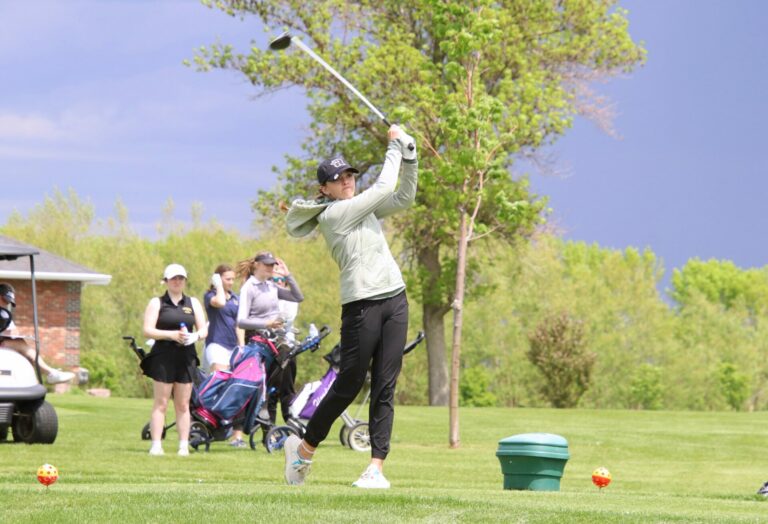Aberdeen Roncalli's Grace Seyer hits a tee shot on the par-four first hole during the Regional 1A tournament Thursday, May 23 at Olive Grove Golf course in Groton. Aberdeen Insider photo by Robb Garofalo.