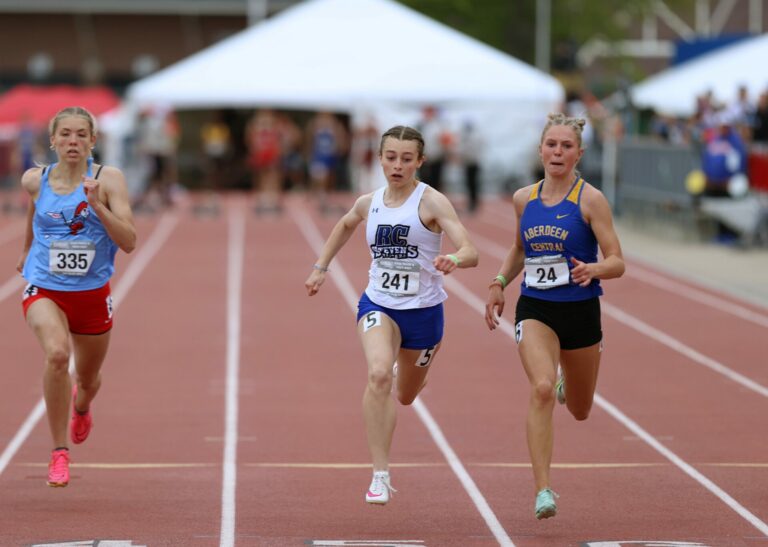 Aberdeen Central's Grace Rife, right , hold off Rapid City Stevens' Ella Bradeen in the Class girls AA 100-meter dash final Saturday, May 25 at Howard Wood Field in Sioux Falls. Photo courtesy of South Dakota Public Broadcasting.