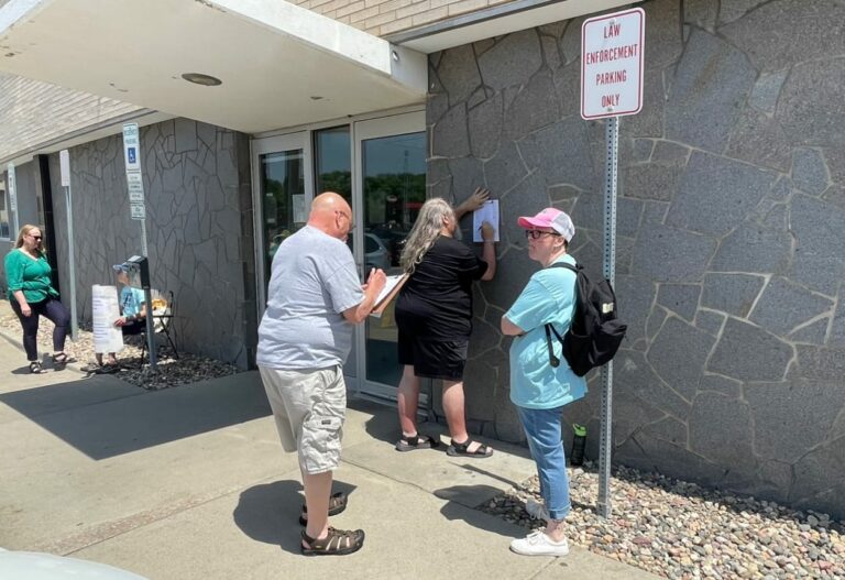 Registered voters sign a petition for a constitutional amendment to expand abortion rights in South Dakota at the Minnehaha County Administration Building on May 26, 2023, in Sioux Falls. The amendment has been certified for the Nov. 5 general election ballot. South Dakota News Watch file photo.