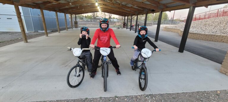 Tyler Heinsohn, center, enjoys BMX racing with his kids Oliver, left, and Lydia. Photo by Sam Schauer for the Aberdeen Insider.