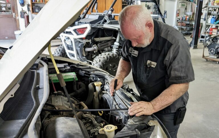 Barry Sroufe works on a customer's air conditioning at B&N Auto Repair on Friday, June 14. After 30 years in business, the shop is closing this week. Aberdeen Insider photo by Scott Waltman.