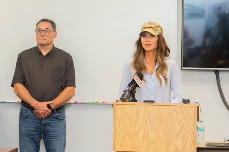 Gov. Kristi Noem speaks during a June 25, 2024, press conference in Yankton while state Department of Public Safety Secretary Bob Perry looks on. Photo courtesy of governor's office.)