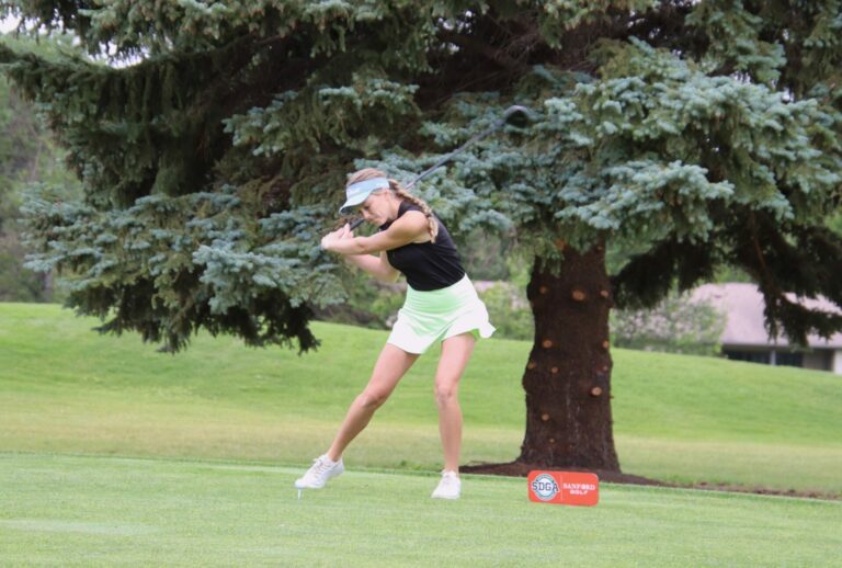 Aberdeen's Olivia Braun leans into her tee shot on the par-four first hole Monday, July 1 during the South Dakota Golf Association Sanford Golf Series event at Moccasin Creek Country Club. Aberdeen Insider photo by Robb Garofalo.