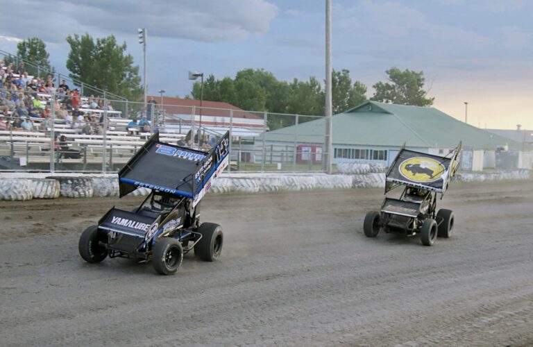 Tim Estenson holds off Mark Dobmeier during their NOSA 410 Sprint Series heat race Friday, June 28 at the Brown County Speedway. Extension would win the Sprint series feature. Aberdeen Insider photo by Robb Garofalo