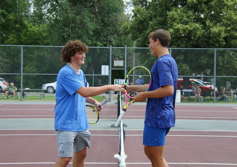 AJ Prehn, left, and Mitch Hofer shake hands following the 18-under singles championship during the C.C. Lett tennis tournament Tuesday, July 9 at the Northern State tennis courts. Hofer won in straight sets. Aberdeen Insider photo by Robb Garofalo.