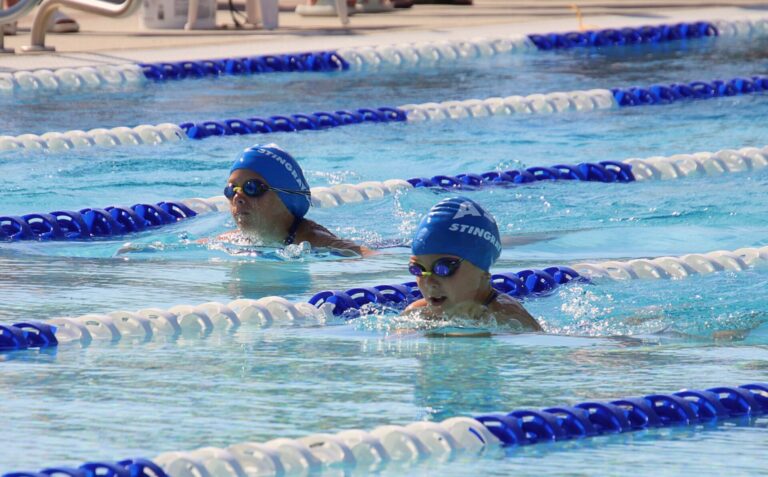 Alex Karst, bottom, and Hailey Hanson compete for the Aberdeen Spin Club in the 50-meter breaststroke Sunday, July 14 during the Long Course State B Championships at the Aberdeen Aquatic Center. Aberdeen Insider photo by Robb Garofalo.
