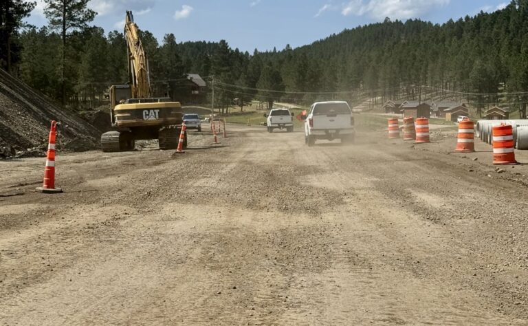 A stretch of U.S. 385 on July 17, 2024, just north of Pactola Reservoir in Pennington County, S.D, that shows the pitted, dusty gravel road bikers will ride if they travel the popular highway during the upcoming 2024 Sturgis Motorcycle Rally. South Dakota News Watch photo by Bart Pfankuch.