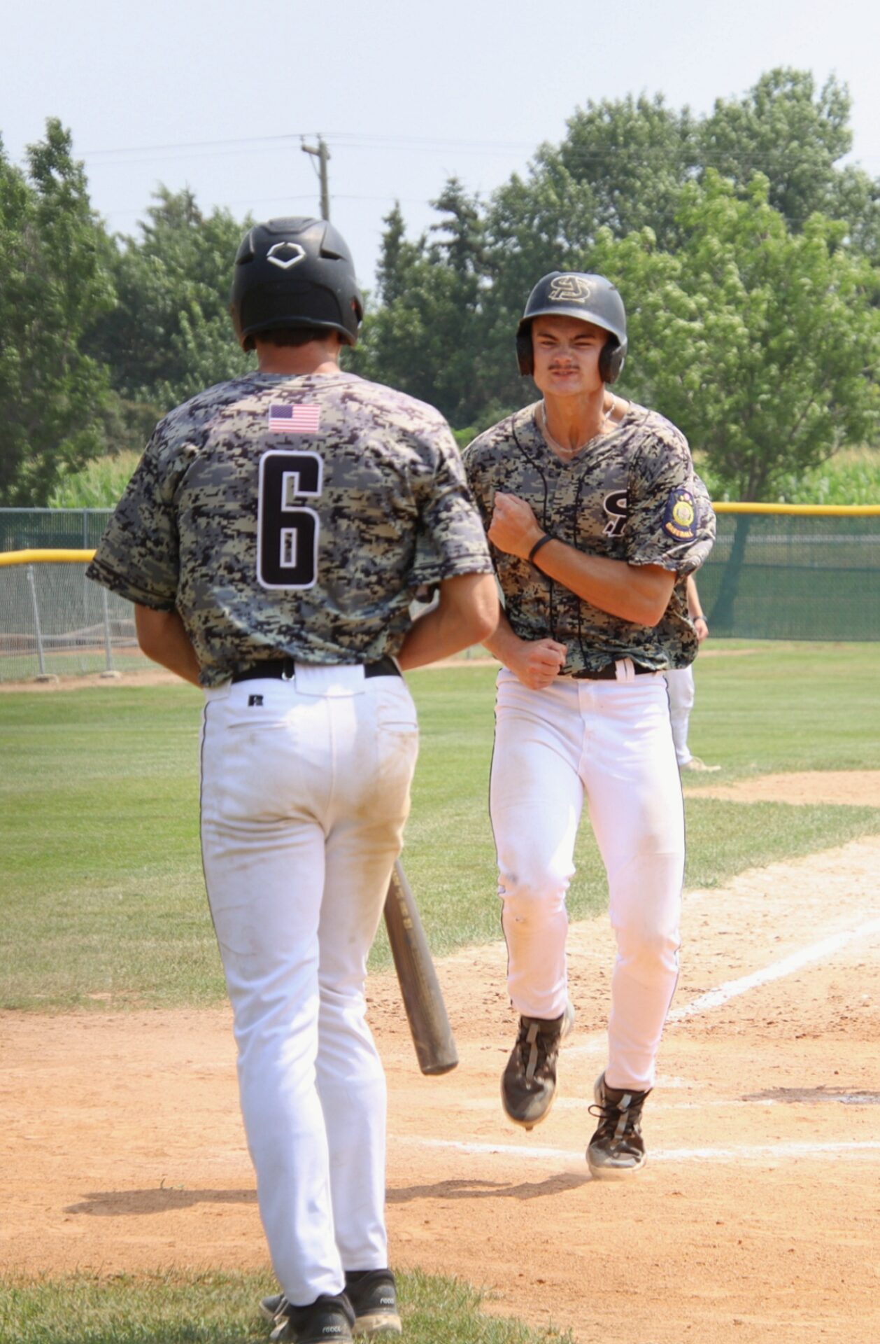 Smittys season ends after extra innings loss to Brandon Valley 1 Cooper Eisenbeisz reacts with teammate Drew Salfrank after scoring in the top of the third inning against Brandon Valley on Friday, July 26 at Fossum Field. Aberdeen Insider photo by Robb Garofalo.