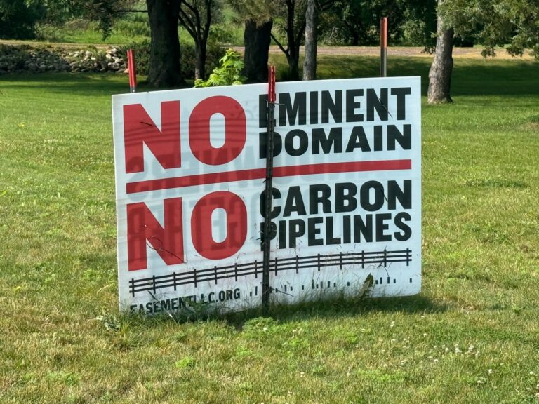 A sign protesting the potential use of eminent domain to access land for carbon pipelines appears July 20, 2024, in Lincoln County south of Sioux Falls. South Dakota News Watch photo by Stu Whitney.