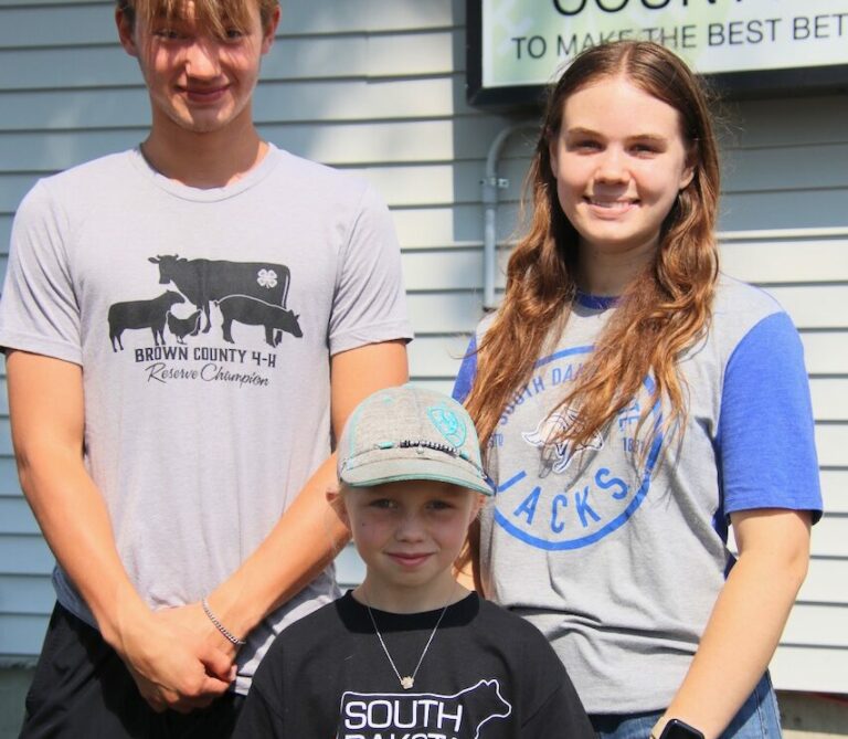 Hunter Kern, Anna Johnson and, front, Karli Allison are three of about 150 4-H'ers who will be showing animals and entering exhibits at the Brown County Fair, which begins Monday, Aug 12. Aberdeen Insider photo by Elisa Sand.