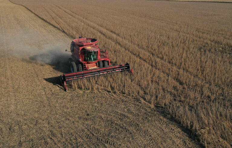 An aerial view from a drone shows a combine being used to harvest the soybeans in a field at the Bardole & Sons farm on Oct. 14, 2019, in Rippey, Iowa. Getty photo by Joe Raedle.
