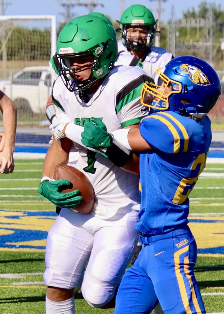 Pierre's Elijah Boutchee hangs on to the ball after catching a pass as Aberdeen Central's Evan Sichmeller makes the tackle Saturday, Aug. 31 at Brownell Activities Complex. The No. 1-ranked governors won the game 20-14. Aberdeen Insider photo by Scott Waltman.
