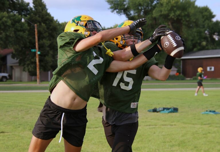 Roncalli's Jett Johnson, left, and James Behan battle for the ball during practice Monday, Aug. 12 at Roncalli High School. The Cavaliers open the season Friday, Aug. 23 against Clark/Willow Lake in Clark. Aberdeen Insider photo by Robb Garofalo.