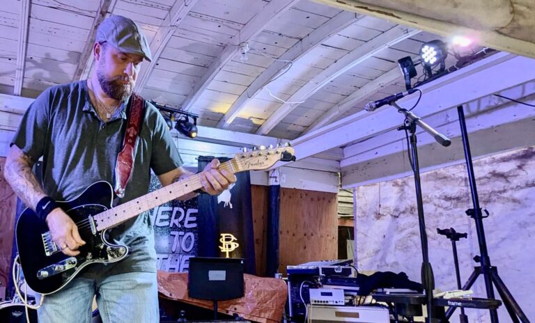 Austin Wellman plays guitar at Centennial Village on Wednesday, Aug. 13 during the 2024 Brown County Fair. Aberdeen Insider photo by Scott Waltman.