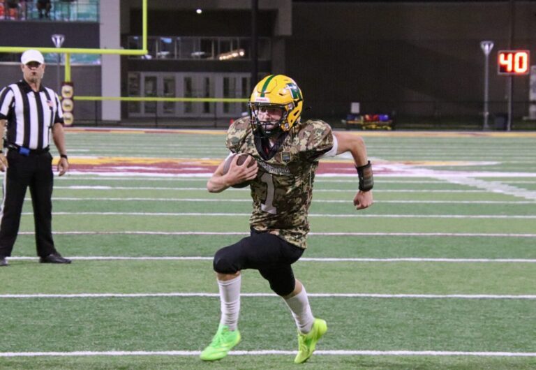 Aberdeen Roncalli's Aiden Fisher breaks into the open and scores a 2-yard touchdown in the fourth quarter against Deuel Friday, Sept. 6 at Dacotah Bank Stadium. Aberdeen Insider photo by Robb Garofalo.