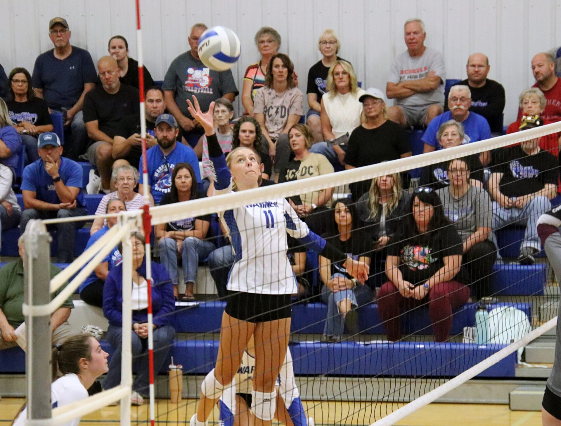 Warner's Kyleigh Schopp tips the ball over the net during the Monarchs match against Aberdeen Christian Thursday, Aug. 29 in Warner. Aberdeen Insider photo by Robb Garofalo