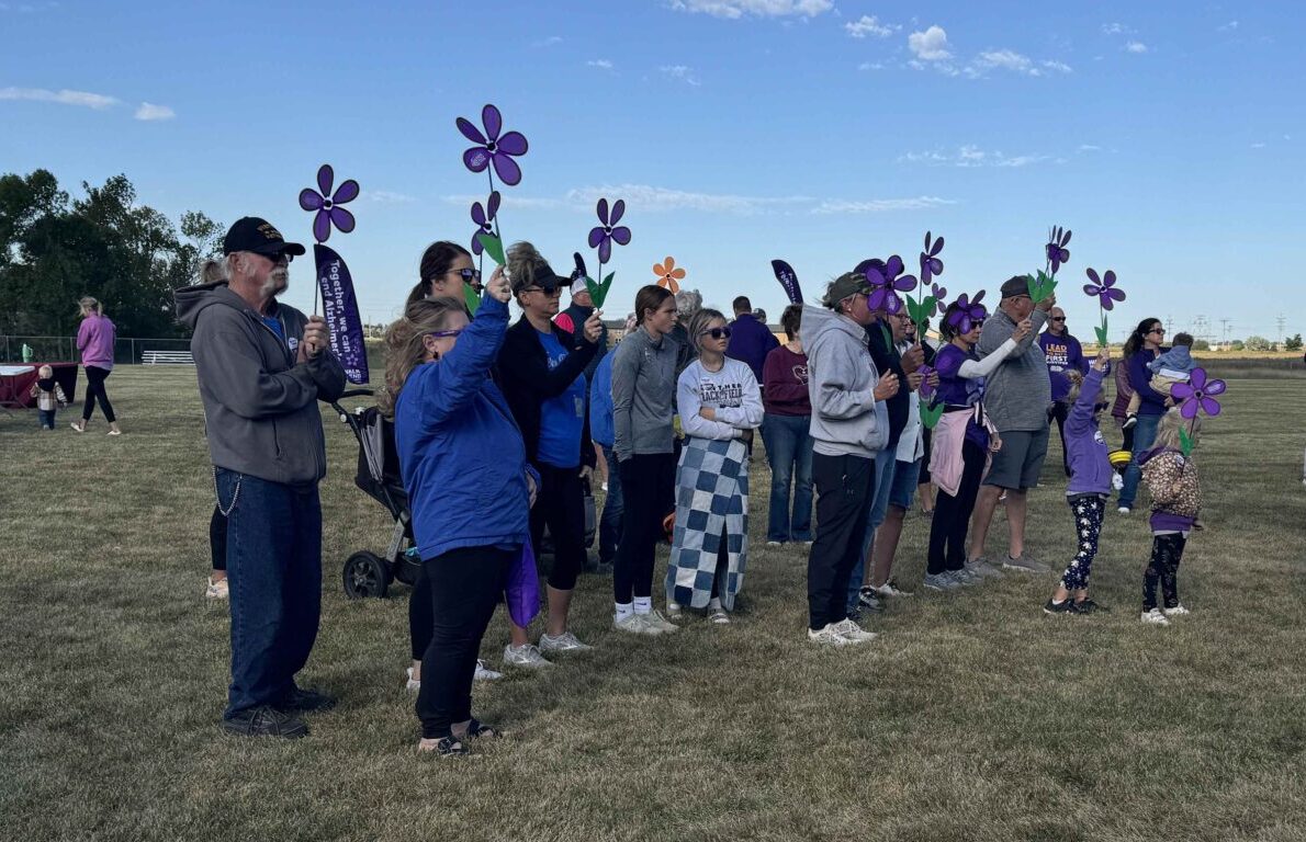 Different colored flowers were handed out to those who participated in 2024 Walk To End Alzheimer's, with each color honoring a different aspect of the fight against the disease. The event was Saturday, Sept. 21 at the Strode Center. Aberdeen Insider photo by Shannon Marvel.