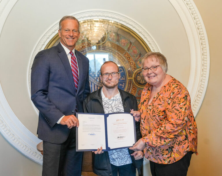 Deb Kuschel of Aberdeen, right, recently visited Washington, D.C., with her son Michael, center, where she was honored as an Angel in Adoption. U.S. Sen. John Thune, R-S.D., left, selected Kuschel for the recognition. Photo courtesy of Sen. John Thune's office.