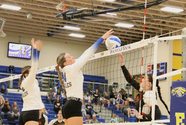 Aberdeen Central's Kenadi Withers comes up with the block of Huron's Jenice Gerogen during the third set Tuesday, Sept. 24 inside Golden Eagles Arena. The Eagles swept Huron in high school volleyball. Aberdeen Insider photo by Robb Garofalo.