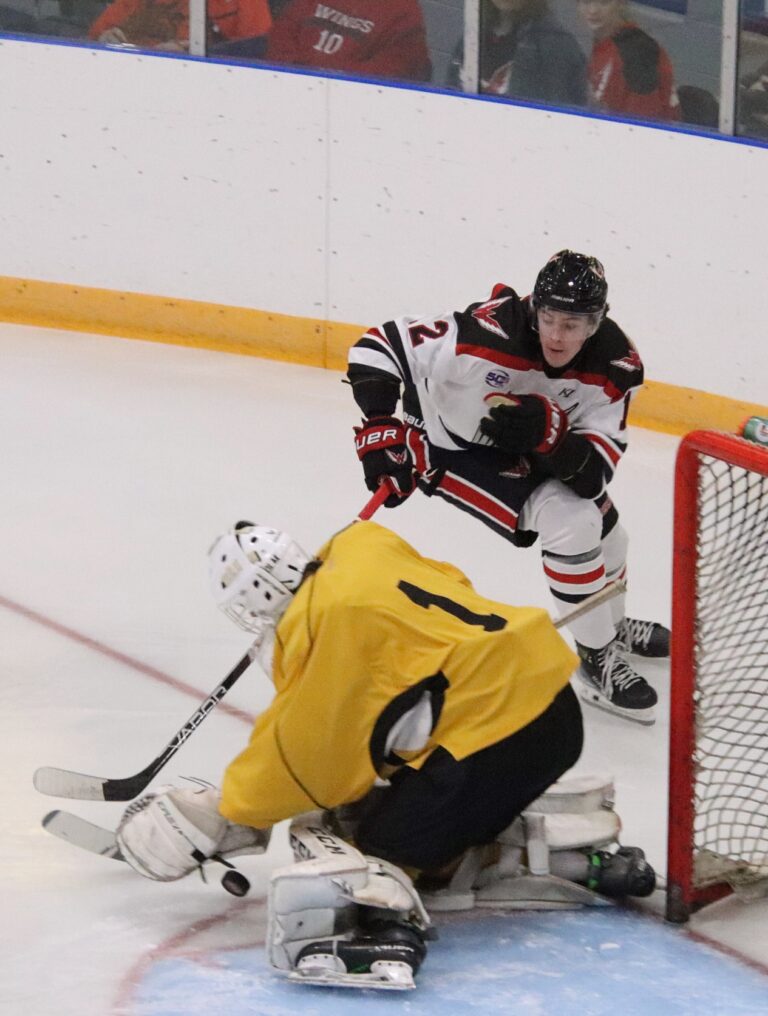 Aberdeen Wings forward Cade Moxham tries to push the puck past Estevan goalie Ben Polhill during a Sept. 8 exhibition game at the Odde Ice Center. The Wings open their home regular season Friday, Oct. 4 against Watertown. Aberdeen Insider photo by Robb Garofalo.