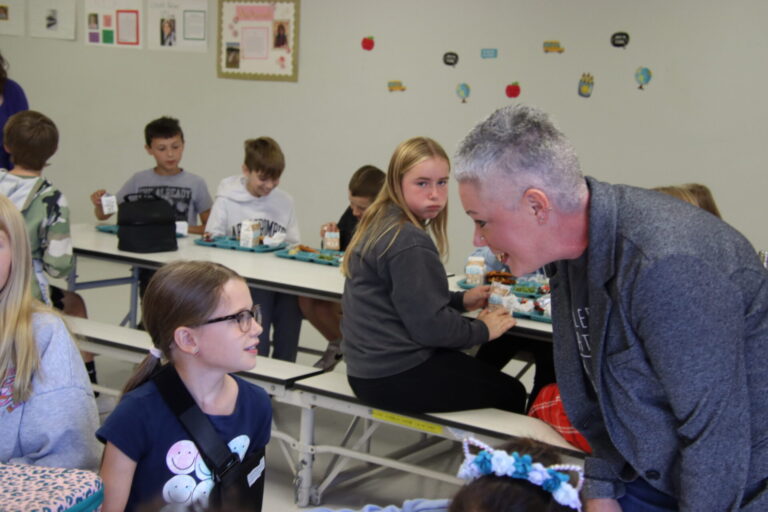 Kiersten Sombke, head administrator of Aberdeen Christian School, touches base with students during lunch hour. Christian will have classes four day a week starting with the next school year. Aberdeen Insider file photo by Shannon Marvel.