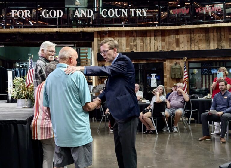 Dusty Johnson greets veterans at a medal-pinning ceremony on Sept. 16 at the Military Alliance building in Sioux Falls. South Dakota Searchlight photo by John Hult.