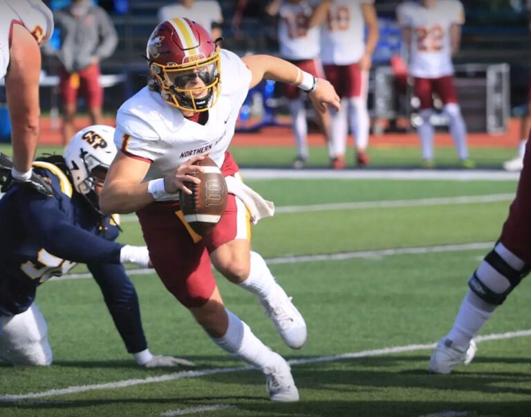 Northern State quarterback Daniel Britt avoids the rush during the Wolves' game against Concordia-St. Paul, Saturday, Oct. 26 at Sea Foam Stadium in St. Paul, Minn. The Wolves won 35-34. Photo courtesy of Concordia-St. Paul Athletics.
