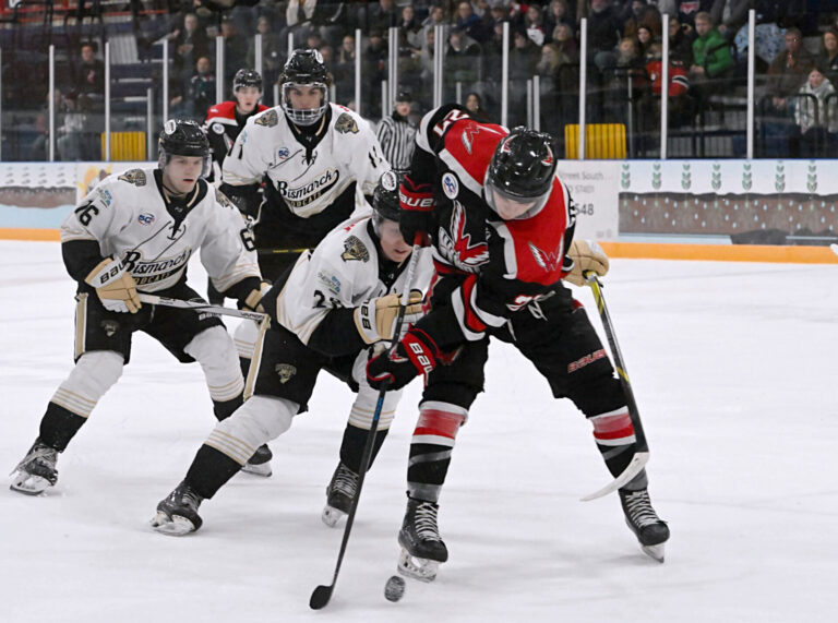 Aberdeen Wings forward Leonid Bulgakov controls the puck ahead of chasing Bismarck defenders Matt Rafalski, Olle Karlsson and Wyatt Sypniewski during the second period Saturday, Nov. 30 in the Odde Ice Center. Aberdeen Insider photo by Robb Garofalo.