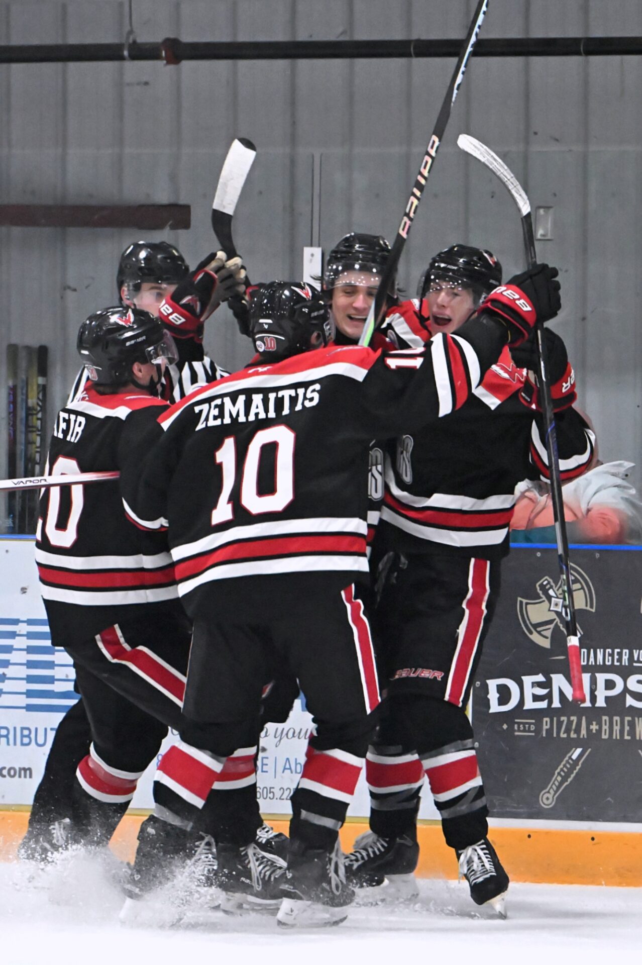 Members of the Aberdeen Wings celebrate Cole Saterdalen's goal in the third period against the Bismarck Bobcats Saturday, Nov. 30 in the Odde Ice Center. Aberdeen picked up a 4-1 victory. Aberdeen Insider photo by Robb Garofalo.