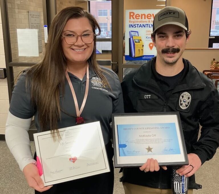 Makayla Ott, a Brown County emergency dispatcher, stands with her husband, Patrick Ott, after receiving the Life Safety Award. Aberdeen Insider photo by Shannon Marvel.