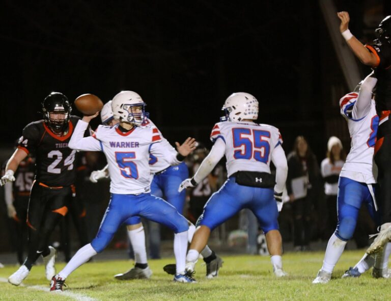 Warner's Drew Bakeberg throws a pass during the Class 9A semifinals Friday, Nov. 9 against Howard. Photo courtesy of Angie Vetter.