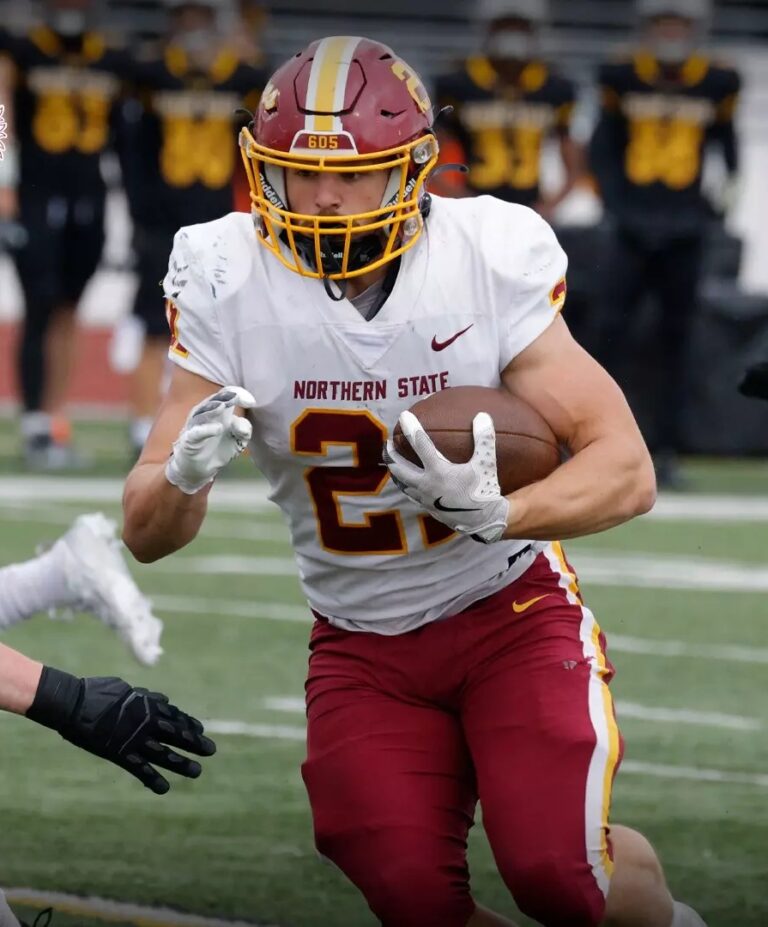 Northern State's Hank Kraft carries the ball during the Wolves game Saturday, Nov. 9 at Wayne State in Wayne, Neb. The Wolves won to finish the season at 6-5. Photo courtesy of Wayne State Athletics.