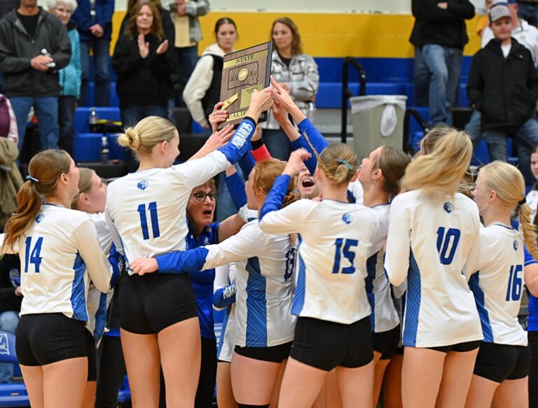 Warner players celebrate advancing to the Class B state volleyball tournament following their SoDak 16 win over Faulkton Area Tuesday, Nov. 12 in Redfield. Aberdeen Insider photo by Robb Garofalo.