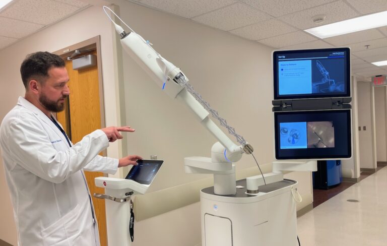 Dr. Deptmer Ashley of Dakota Pulmonary, explains how the robotic system works during a procedure to find and test suspected tumors in a patient's lung. Aberdeen Insider photo by Elisa Sand,