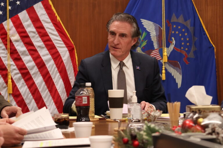 North Dakota Gov. Doug Burgum takes part in a discussion of Summit Carbon Solutions’ proposed injection wells during a meeting of the North Dakota Industrial Commission on Dec. 12, 2024, in Bismarck. North Dakota Monitor photo by Mary Steurer.