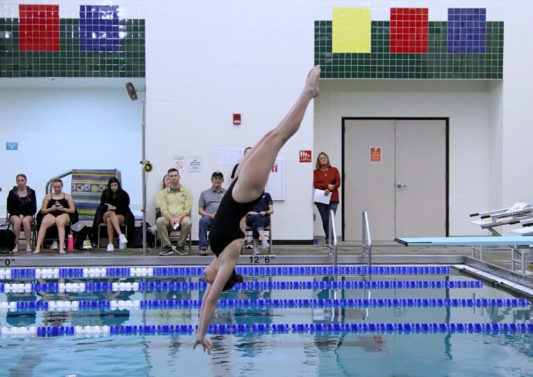 Northern State diver Jacie Flockhart completes a dive during a meet last year against the University of Mary at the Aberdeen Family YMCA. Aberdeen Insider photo by Robb Garofalo.
