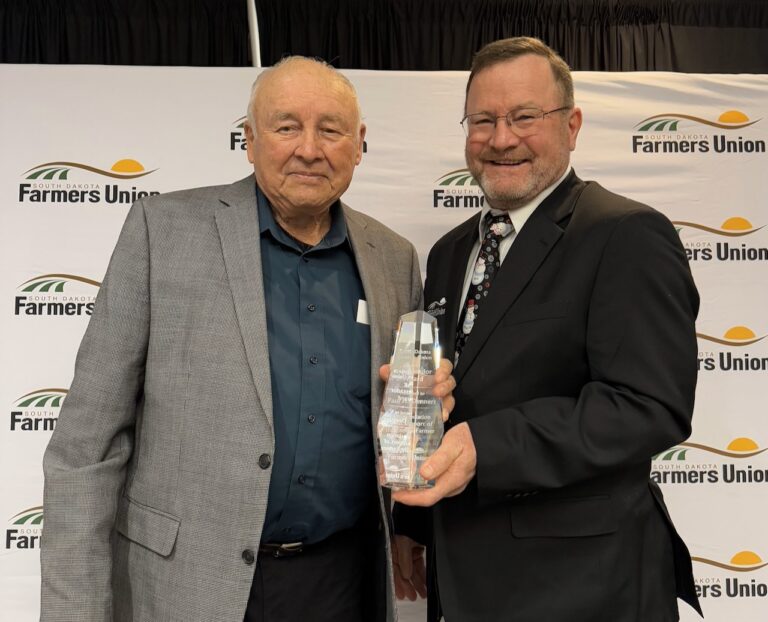 Columbia farmer H. Paul Dennert, left, was recognized as an ag ambassador by South Dakota Farmers Union for his leadership and service to South Dakota agriculture. He received the award from South Dakota Farmers Union President Doug Sombke of Conde earlier this month in Huron. Photo courtesy of the South Dakota Farmers Union.