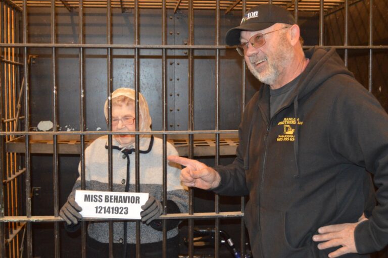 Groton Mayor Scott Hanlon, right, took part in a recent fundraiser for the Groton Historical Society. The event involved 101-year-old Elda Stange's brief incarceration in the old city jail for failing to pay her birthday tax. Courtesy photo.