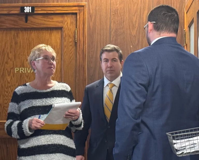 Lynne Hunsley (left) with her attorney after pleading guilty to two felony charges Monday at the Hughes County Courthouse. Dakota Scout photo by Austin Goss.