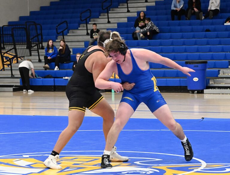 Aberdeen Central's Joran Foss stands and escapes from the hold of Mitchell's Rocky clark during their 285-pound wrestling match Monday, Dec. 30 inside Golden Eagles Arena. Aberdeen Insider photo by Robb Garofalo.