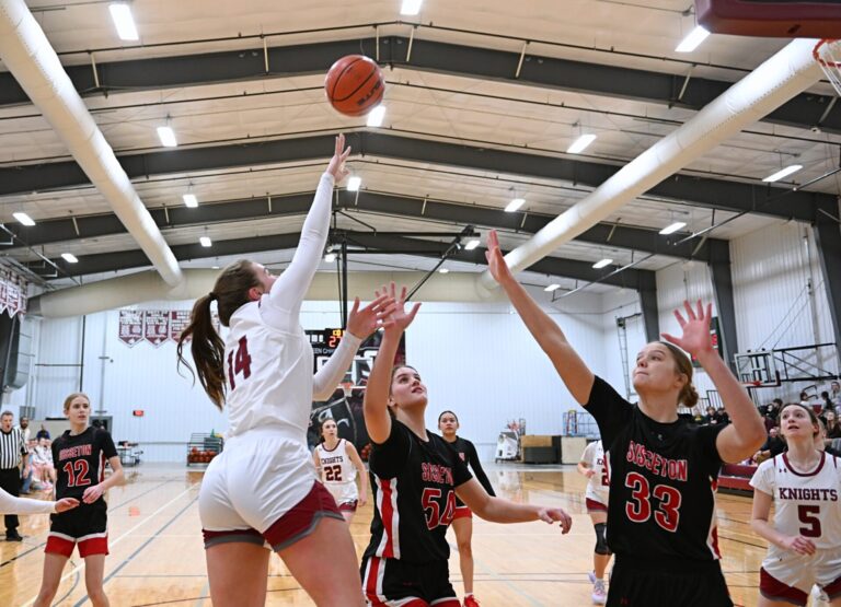 Aberdeen Christian's Sophia Eichler takes a floater over Sisseton's Krista Langager (54) and Saylor Langager during the second quarter Monday, Jan. 6 inside the Christian Gym. Aberdeen Insider photo by Robb Garofalo