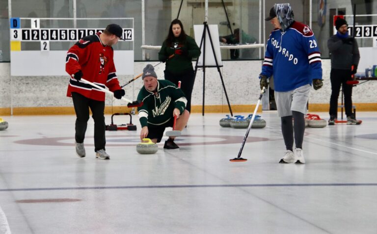John Hilton releases a stone as Aaron Scholl, left, and Tim McCurdy prepare to sweep during a game at Aberdeen Curling Club's 2025 Broom Snapper Bonspiel on Saturday, Jan. 4 at the Holum Expo Building. Aberdeen Insider photo by Scott Waltman.