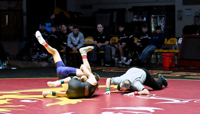 Northern State's Sloane Johannsen rolls Sioux Falls' Daniel Parra during their 125-pound match Friday, Jan. 10 inside Wachs Arena. Johannsen pinned Parra as the Wolves won the dual 41-4. Aberdeen Insider photo by Robb Garofalo.