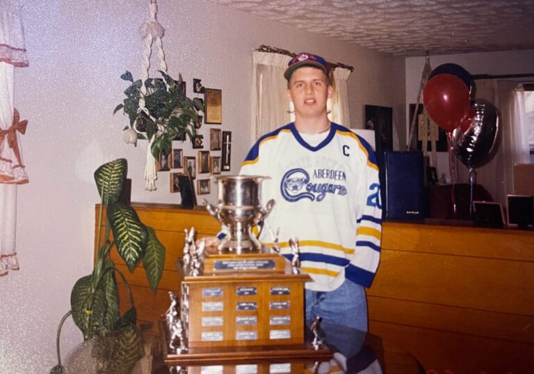 Greg Swanson with the South Dakota state hockey championship trophy won by Swanson and the Aberdeen Cougars in 1992. A scholarship in Swanson's name was recently created by the Aberdeen Amateur Hockey Association. Courtesy photo.